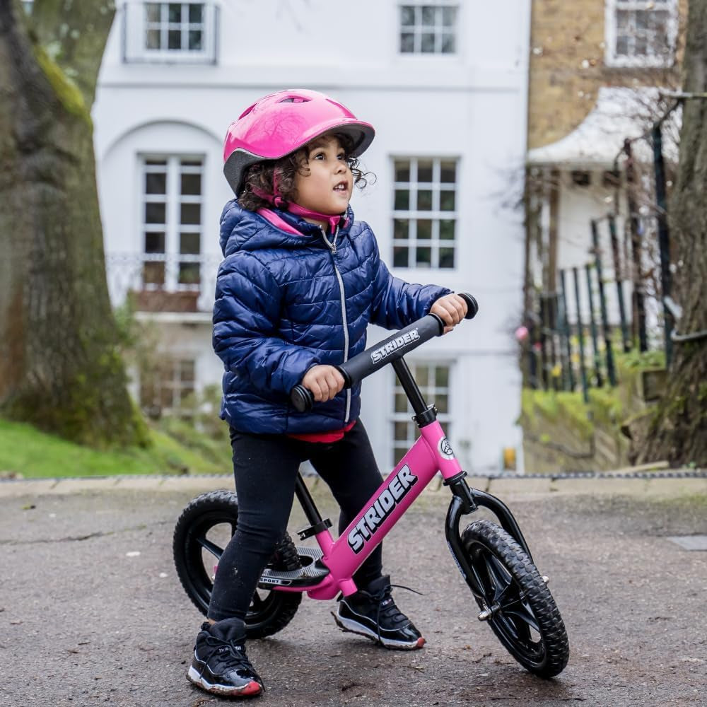 Strider 12” Sport Balance Bike for Children Aged 1 to 4 Years - Features Safety Pad, Padded Seat, Mini Grips, and Flat-Free Tires - Easy Tool-Free Assembly and Adjustments